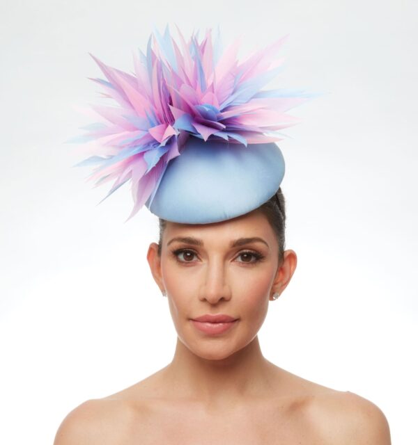 Baby blue cap with pink purple and blue adornment