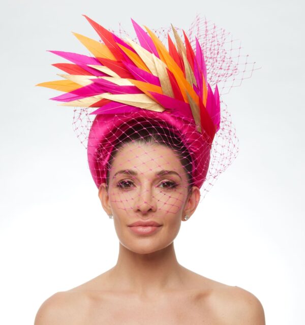 Magenta soft headband with orange pink and gold feathers and veiling