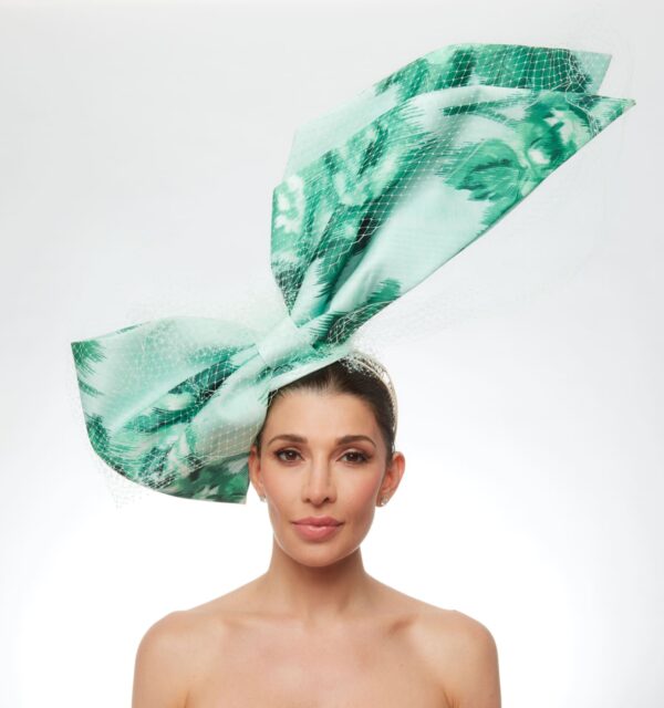 Green floral angled bow with white veiling