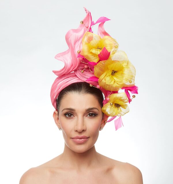 Hot pink turban with yellow feather flowers