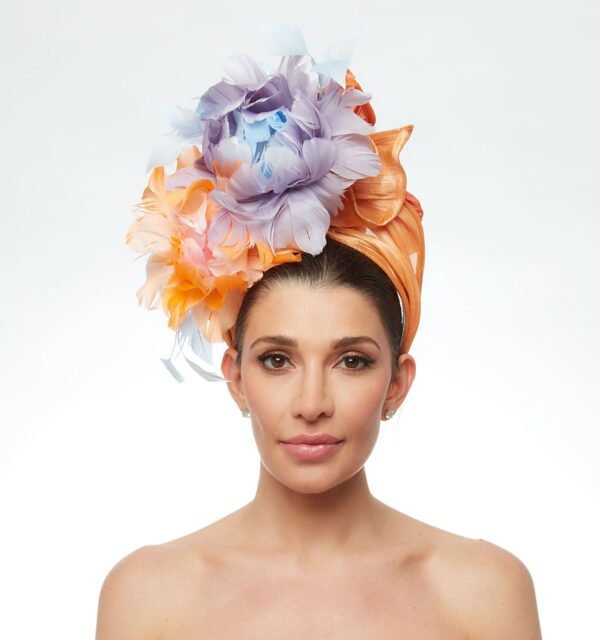 Coral turban with blue and peach feather flowers