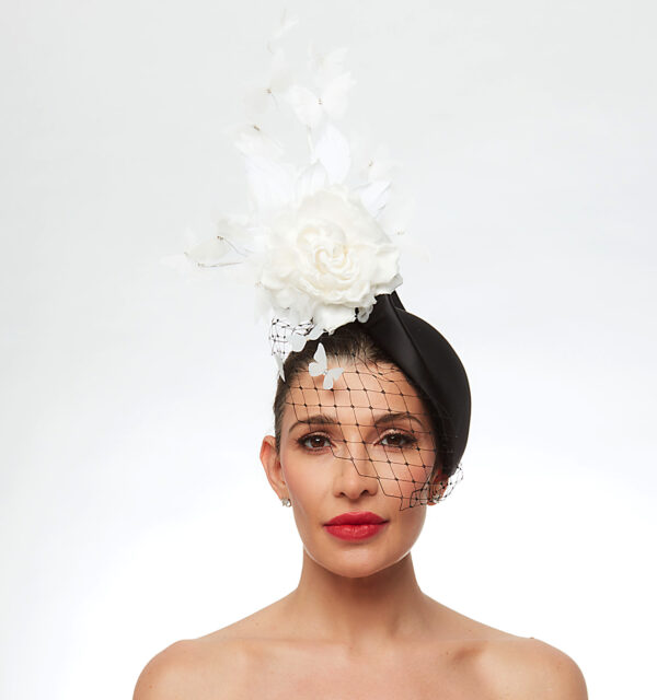 Black cap with white butterflies veil flower and feathers